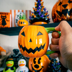 a halloween decor shelf to get people excited for a halloween lifestyle with the halloween countdown calendar including halfway to halloween